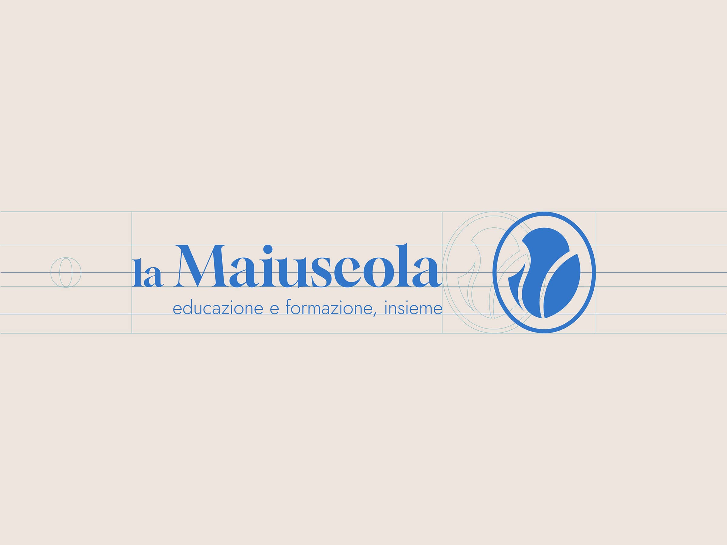 Logo of la Maiuscola featuring blue text and an abstract flower symbol on a light background with design grid lines.