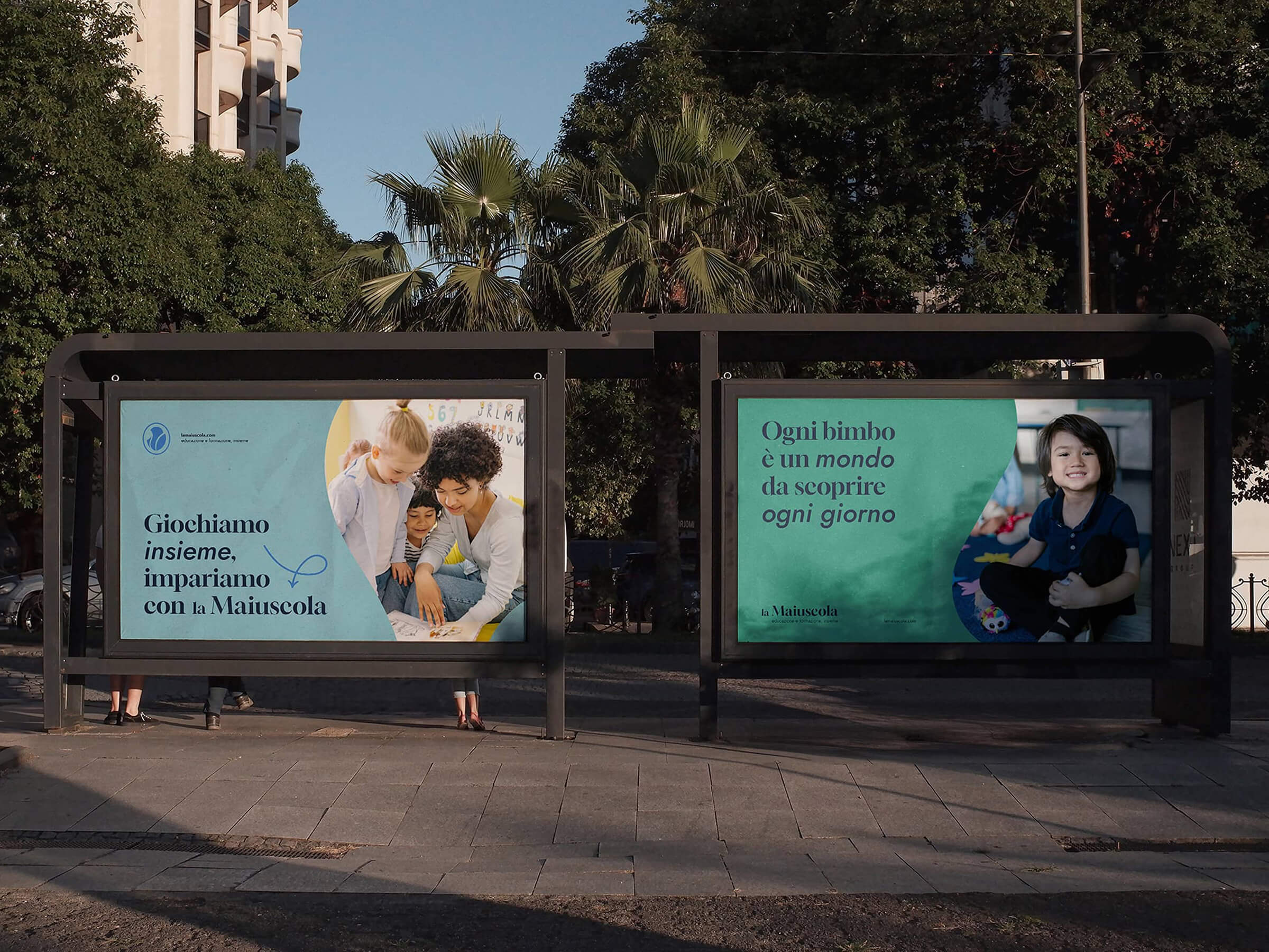 Two bus stop advertisements featuring children and Italian text about learning and discovery with La Maiuscola.